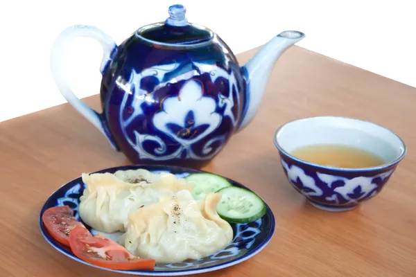 stock image Uzbek Dumplings - mandu and teapot with cup