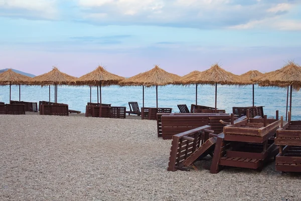 stock image Beach Chairs and Umbrellas on a Black Sea.