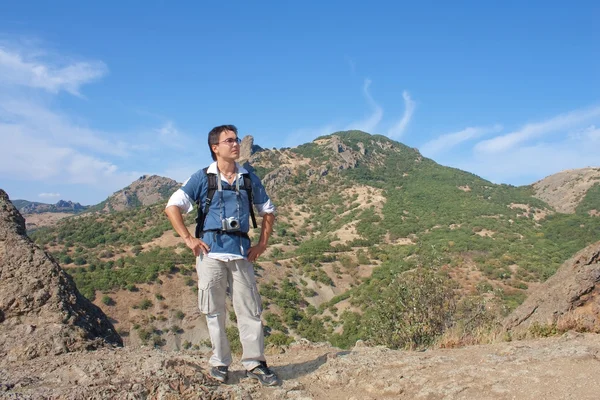 stock image Young man with digital camera on top of the Karadag mountain, Na