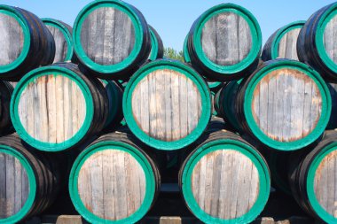 Warehouse with wine casks with madeira outdoors clipart