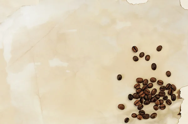 コーヒー豆、背景を持つ古い紙 — ストック写真