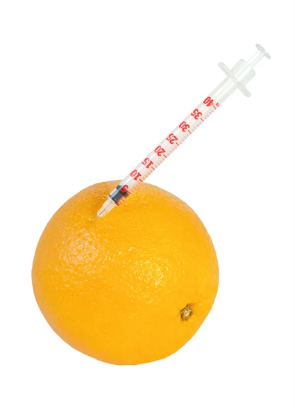 stock image Syringe in orange isolated on white