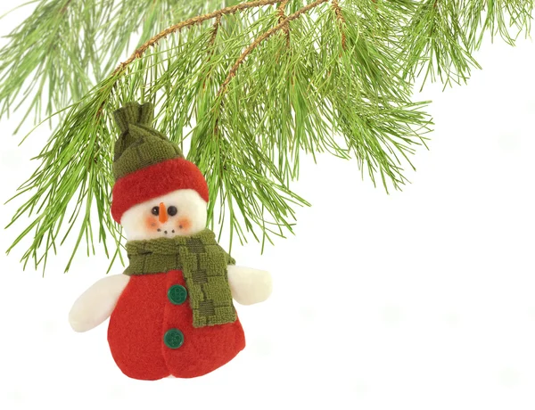 Cute snowman under a pine tree isolated on white — Stock Photo, Image