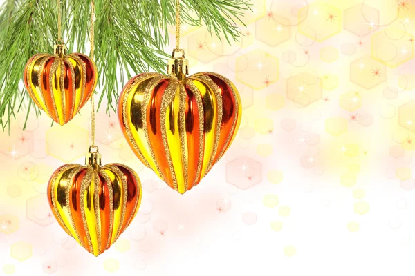 Christmas balls – hearts on pine tree branch — Stock Photo, Image