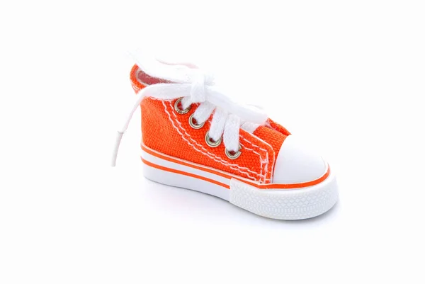 Оранжевый кроссовок — стоковое фото