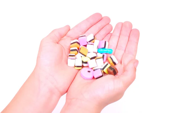 Child hands with sweets — Stock Photo, Image