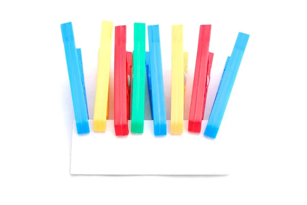 Pegs with blank card — Stock Photo, Image