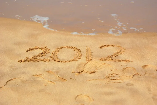 Année 2012 écrite en sable — Photo