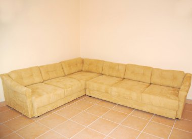 Couch in empty room clipart