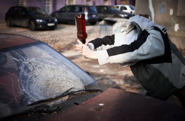 Hooligan smashing windshield clipart