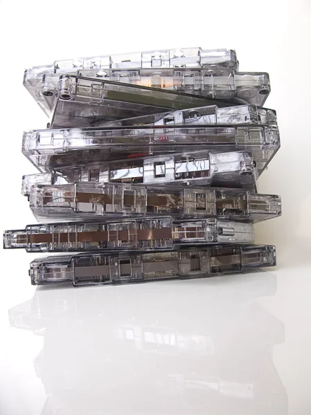 Stock image A pile of old fashioned cassette tapes, isolated in white