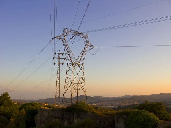 Electric posts at dusk — Stock Photo, Image