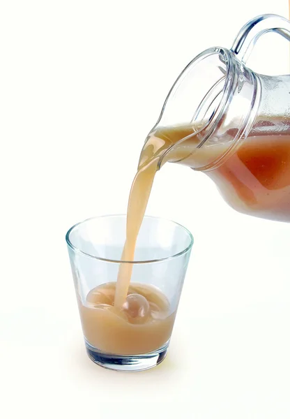 Pear juice is poured — Stock Photo, Image