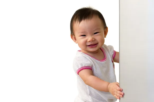 Asian 10 month old baby girl, with cheeky smile — Stock Photo, Image