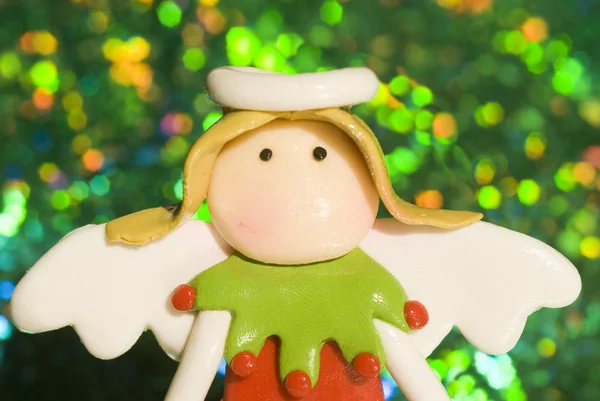 圣诞天使在明亮的绿色背景 — 图库照片