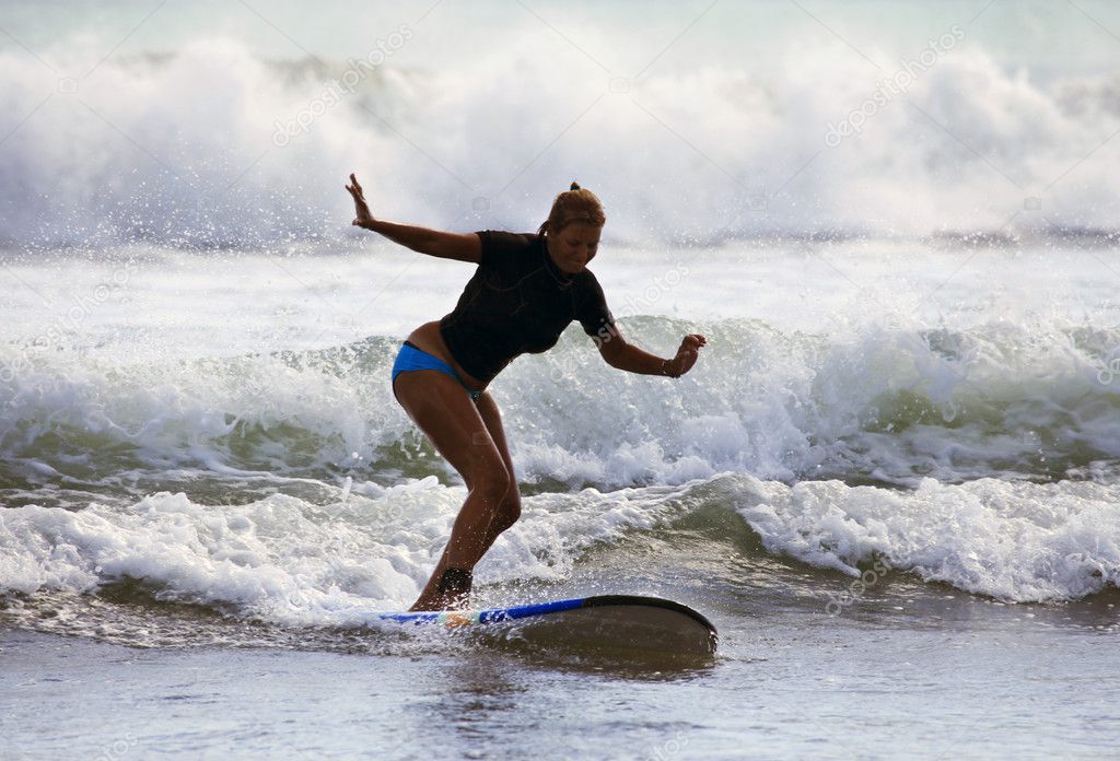 Woman - surfer in ocean