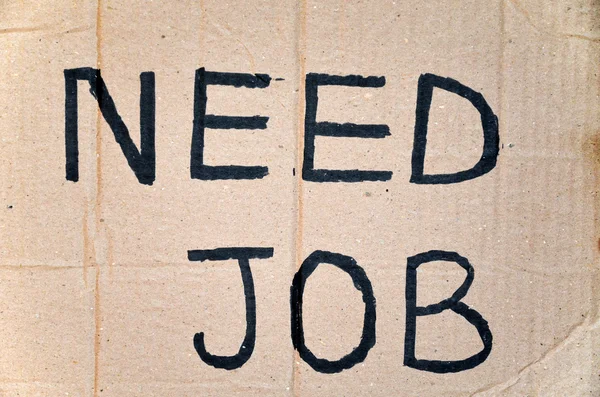 Need job written on cardboard — Stock Photo, Image