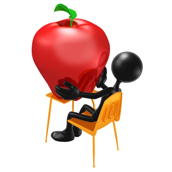 Estudante com maçã gigante na mesa — Fotografia de Stock