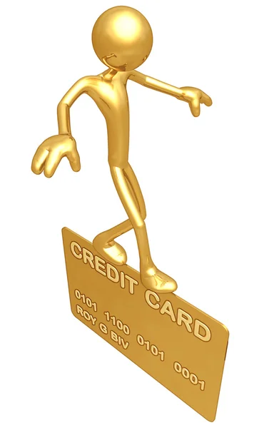 Балансування по золотій кредитній картці — стокове фото