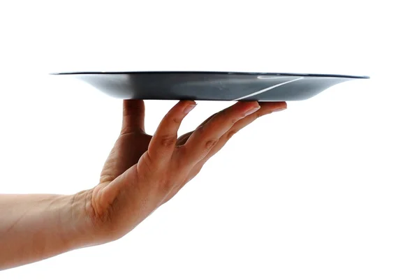 いっぱいになる空の黒い皿を持つ女性の手 — ストック写真