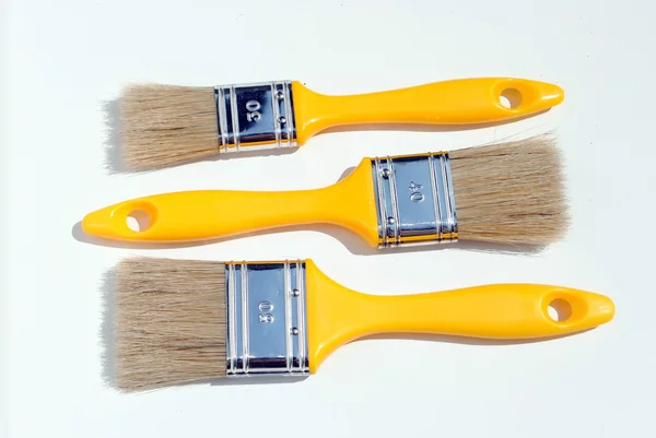 Three yellow paints, different dimension — Stock Photo, Image