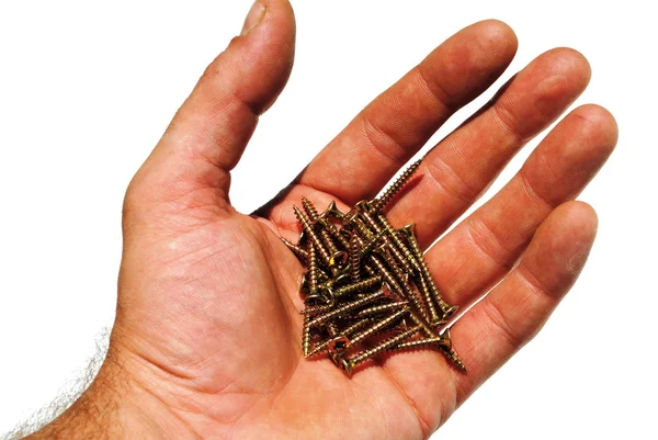 Man hand holds some screws — Stock Photo, Image