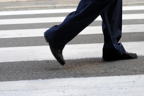 Classic urban zebra crossing with business man feet — Stock Photo, Image