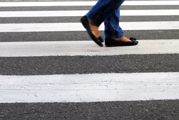 Classic urban zebra crossing with feet — Stock Photo, Image