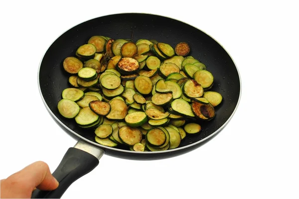 Cooked cougrettes with rosemary in frying pan on white background — Stock Photo, Image