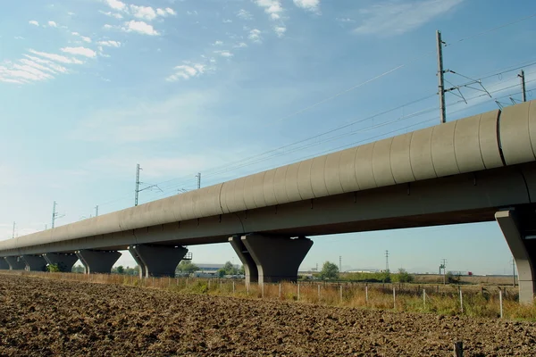 stock image High speed train elevated railway in farmlands