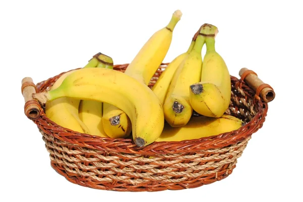 Bananas in a straw basket isolated on white background — Stock Photo, Image