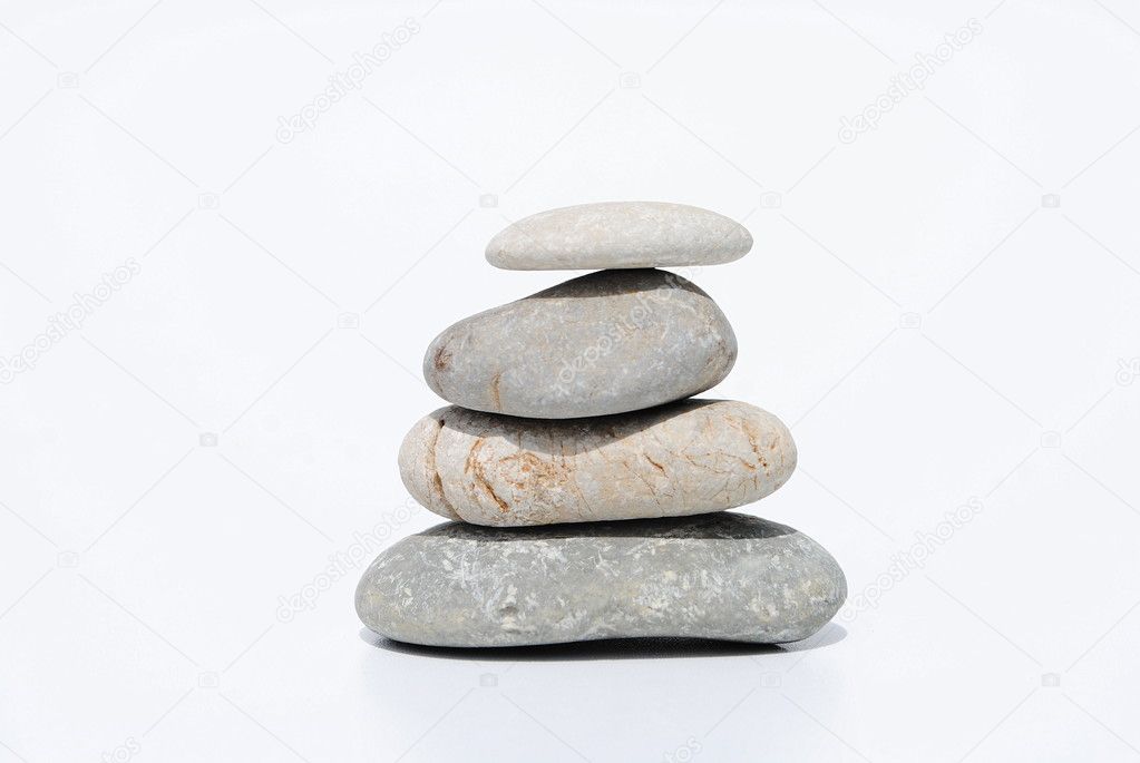 Four zen stones on white background