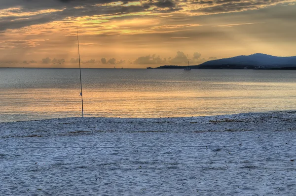 Canne à pêche au coucher du soleil — Photo