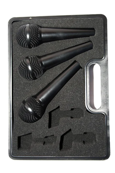 Три набори мікрофонів у чорній коробці — стокове фото