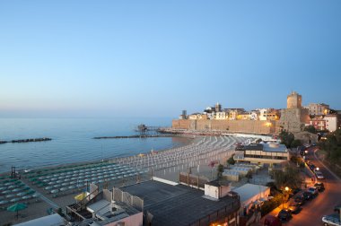 Termoli (Campobasso, Molise, Italy) - The beach at evening clipart