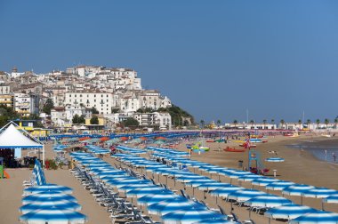 Rodi Garganico (Gargano, Puglia, Italy)and the beach at summer clipart