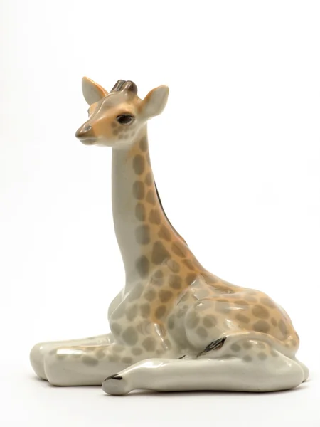 Фигурка лежащего жирафа — Zdjęcie stockowe