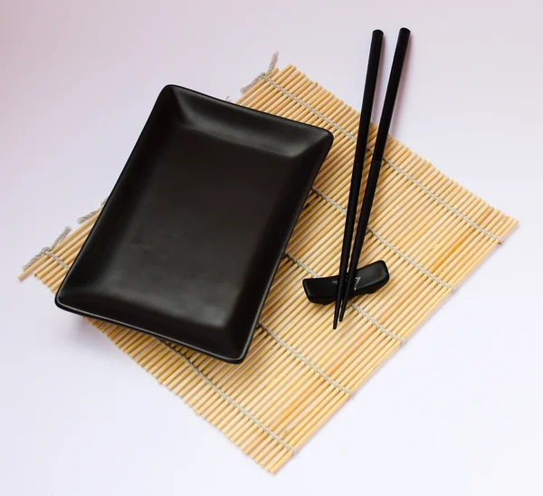 stock image Sushi sticks and black plate