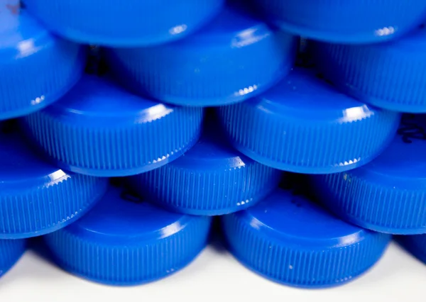 Műanyag kupakok egy sorban — Stock Fotó