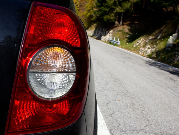 stock image Rear car light with mountain background