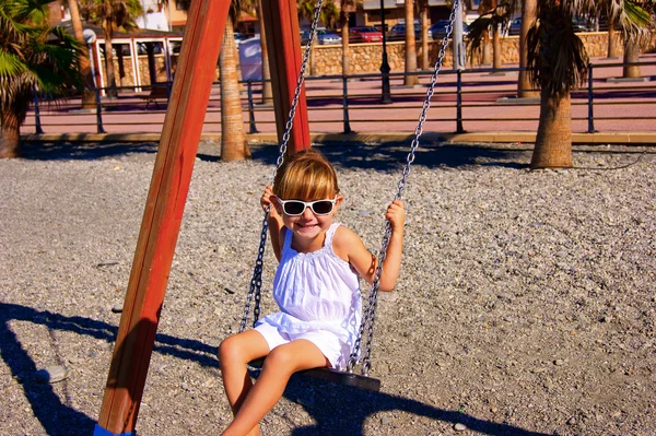The girl on a swing — Stock Photo, Image