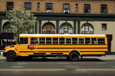 Yellow School Bus in New York City clipart