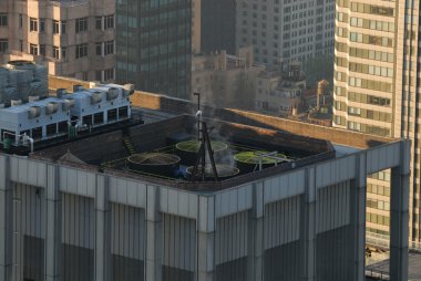 Airconditioning on top of a skyscraper clipart