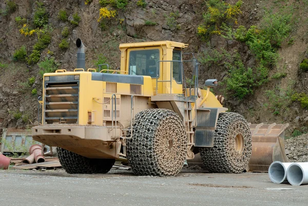Large bulldozer in a stone pit — Stock Photo, Image
