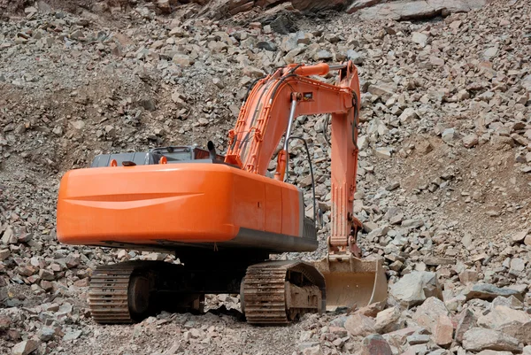 Red excavator in a stone pit — Stock Photo, Image