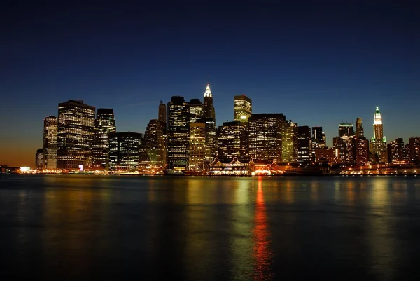 Manhattan skyline à noite — Fotografia de Stock