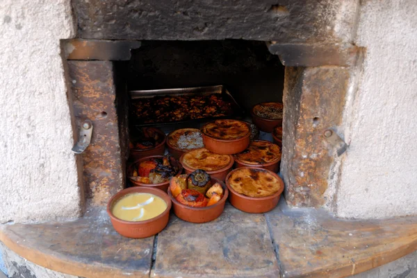 Fresh prepared Greek dishes in the oven