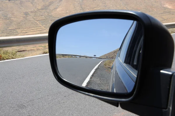 Road in rear view mirror, Fuerteventura Spain — Stock Photo, Image