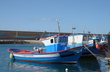 Fishing boats in the harbor. Morro Jable, Fuerteventura, Spai clipart