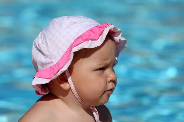 Portrait of a cute toddler girl at the swimming pool — Stock Photo, Image